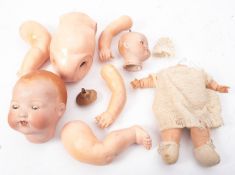 Estate of a doll restorer: an Armand Marseille bisque headed baby doll, 351/8K, cracks and losses,