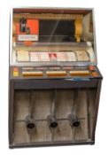 A 1957 Seeburg KS200 jukebox, vertical record stack with orange cased 'Select-O-Matic' system,