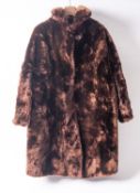 Two fur coats, one by Martins of London, together with a fur cape, three fur hats,
