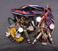 A collection of fourteen various whistles including two by J. Hudson & Co.