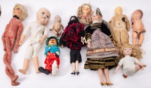 Estate of a doll restorer: nine various dolls, some in the construction process,