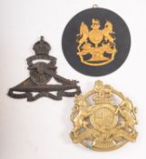 A mid- 20th century circular brass King's Arms trivet, 15cm diameter,