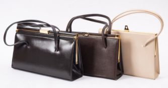 Five early 1990's leather handbags, one brown, two black one cream, one green,