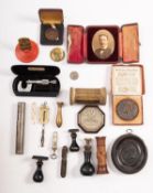 An accumulation of miscellaneous collectables, including an RMS Lusitania Medal in case, a whistle,