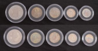 A 1953 proof half crown and six pence, 1950, and English and Scottish shillings,