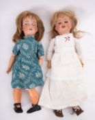 Two Armand Marseille bisque head dolls, both with applied wigs, blue glass sleeping eyes ,