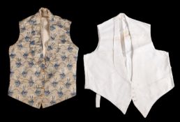 A late Georgian silk waistcoat, woven leaf pattern with lace trim to nape,