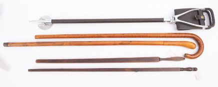 Two Danish/ treen Customs measuring sticks, together with a shooting stick and two walking sticks.