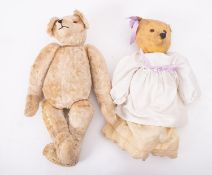 An early 20th century style white plush teddy bear, with glass eyes,