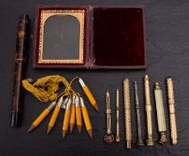 A group of seven Victorian and later propelling pencils, together with seven notepad pencils,