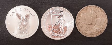 Britannia 1998 one ounce coin with 1995 Australia once ounce with 1935 Crown.