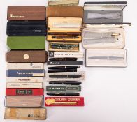 A mixed collection of pens, including:- Cross: a gold filled ballpoint and a propelling pencil set,