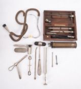 A small collection of various medical instruments, including a stethoscope, reflex hammer etc.