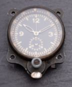 A WW2 Luftwaffe cockpit clock, possibly Junghans, with luminous hands and dial,