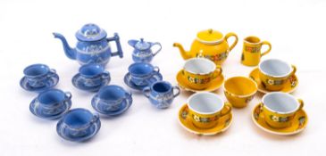 An early 20th century Child's enamel tea service, in blue and yellow with floral decoration.