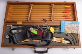 A cased Selector Compound archery bow,