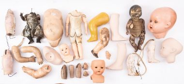 A collection of various composition and porcelain doll parts