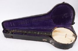 An early 20th century five string banjo stamped ,' Du Garde.