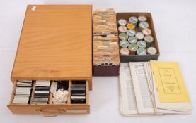 A Bakelite' Viewmaster' and slides in a brown and cream Bakelite case together with a collection
