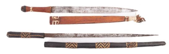 An African leather mounted short sword and a similar sword stick (2)