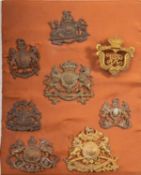 A group of seven Victorian and Edwardian Armorial badges and crests,