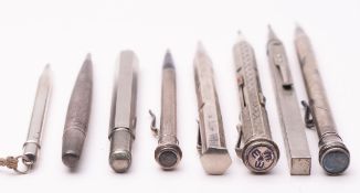A group of eight various silver plated propelling pencils, including three advertising examples.