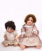 An Armand Marseille bisque head doll 390, mousy blonde mohair wig blue eyes,