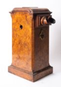 A Victorian walnut tabletop stereoscopic viewer, moulded cornice over wooden eyepiece,