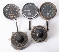 Two Smyths dashboard clocks, a Smyths speedometer,