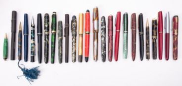 A mixed collection of fountain pens and a few pencils,