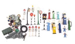 Dinky,and others. An unboxed group of various road signs ,petrol pumps and figures etc.