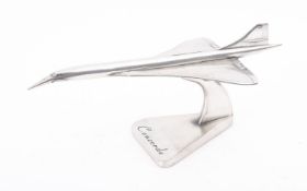 A plated resin model of Concorde on a trefoil stand,41cm long.