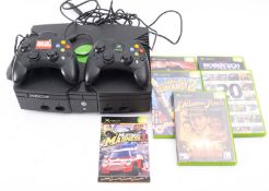 A XBOX two controllers and four games and a demo disc.
