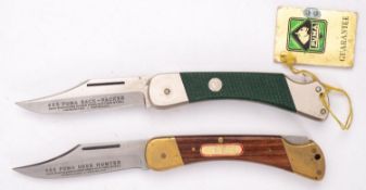 A Puma 965 Deer Hunter Knife and a Puma 465 back packer knife in original green and yellow plastic