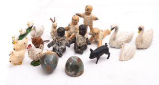 Five lead cast baby dolls and eleven various animals,