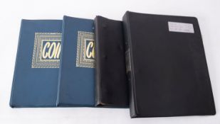 Four coin albums containing a quantity of world coins, including silver with pre 1947 British coins,