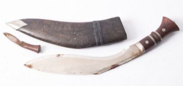 A Kukri style India knife with hardwood handle- not marked in leather scabbard, with smaller knife,