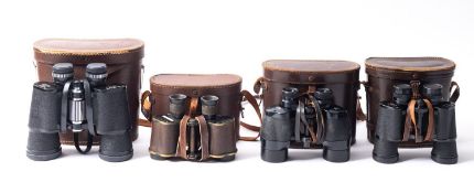 Eleven pairs of cased binoculars,