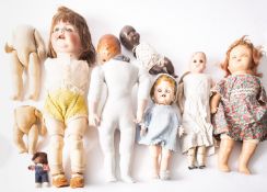 Estate of a doll restorer: a collection of dolls in various states of restoration cracked heads,