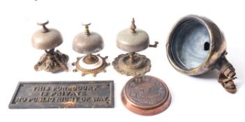 A Victorian gilt brass table bell, together with two other table bells, a copper Daimler ashtray,
