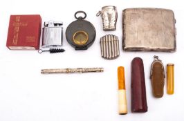 A collection of smoking memorabilia comprising a silver cigarette case, Birmingham 1946,