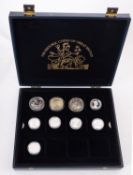 A box containing silver 50p's, United States 1922 dollar, 2010 Brittania one ounce and 2009.