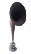 An early 20th century Western Electric style speaker with brown mache horn on a black iron base