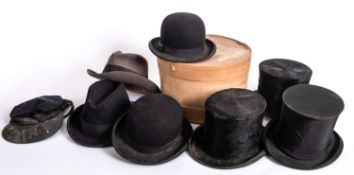 Two black felt bowler hats by Woodrow of London, 51 cm, together with two felt top hats,