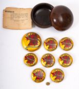 A collection of seven painted and gilded buttons with a red dragons head with H.