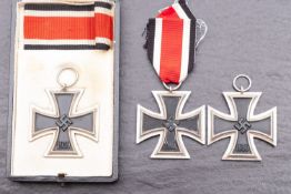 Three WWII Iron Crosses, one with ribbon in case of issue and one other with ribbon.