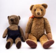 An early to mid 20th century blonde mohair plush teddy bear, with boot button eyes,