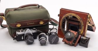 A Thornton Packard half plate camera and a Pentax 30mm SLR Camera.