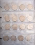 An album of coins, including 1924 silver dollar, two 1935 Crowns, 1966 Irish ten shilling coin,