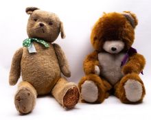A mid 20th century large blonde plush teddy bear, with orange glass eyes,